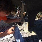 Hacksawing out old cutlass bearing