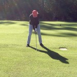 Golfing day, mom at bat