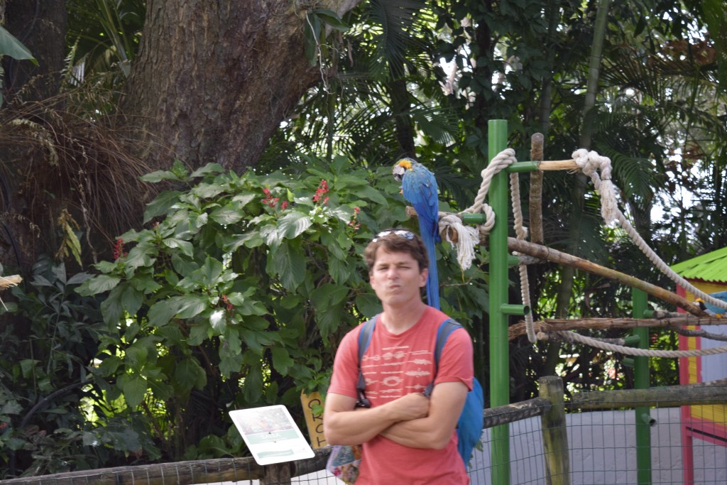 Mike posing with one of the parrots.